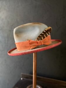 A bespoke feathered hat by Garey Hull