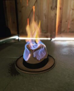 Fedora hat on fire by Hull & Sons